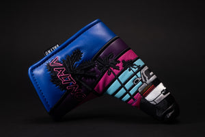 Miami 80s retro golf putter blade headcover showing a white Italian sports car with two doors going down the black paved road towards the sunset in Miami Beach Florida with palm trees made by Valtno a luxury golf cover