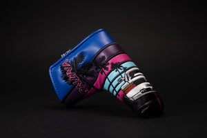 Miami 80s retro golf putter blade headcover showing a white Italian sports car with two doors going down the black paved road towards the sunset in Miami Beach Florida with palm trees made by Valtno a luxury golf cover