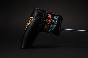 Black golf headcover made for a blade putter like a Scotty Cameron Newport 2 and many other brands. This pizza putter cover shows neon pizza signs from New York City where the pizza shop only allows whole pies to be purchased and has a no slices policy. The nyc skyline is embroidered on this high quality golf putter cover. You’ll love to take one bite or more from this headcover