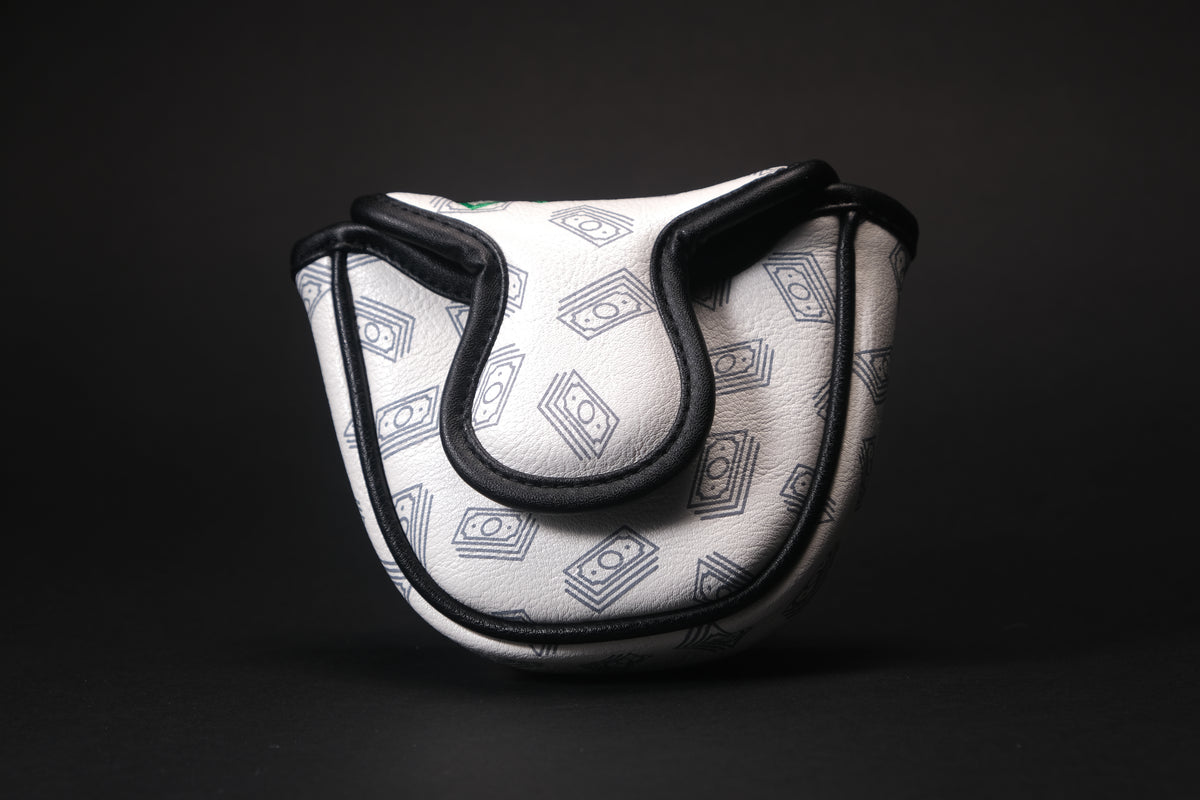 Cool golf putter headcover showing the cash boy or paperboy throwing paper or stacks of cash while riding a black bike and wearing joggers and a sweatshirt that fits most mallet covers and is made of luxury materials